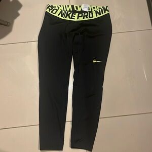 Nike Pro size 2XL color black and green gently used